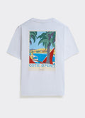 The white Percival Azur T-shirt in cotton jersey, featuring a colourful Côte d’Perci Riviera graphic on the back.