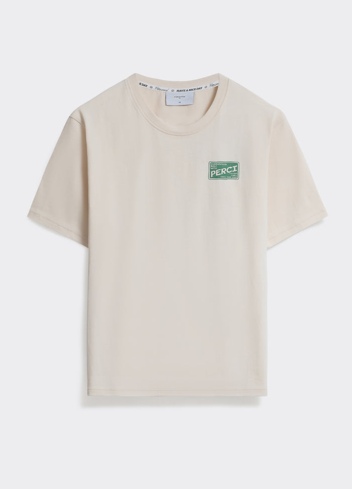 The Percival Cycle T-Shirt in cream jersey, featuring a green vintage-style chest graphic, shot on a white background.
