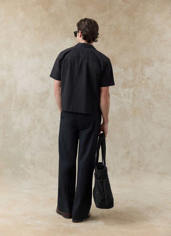 Black cotton Percival Daniel Boxy Cuban Shirt seen from behind; want more? Check out our SS26 collection.