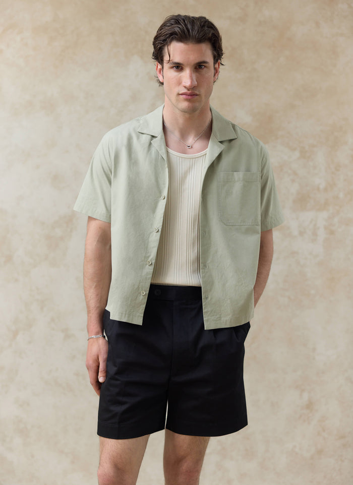 Open Pistachio cotton Percival Daniel Boxy Cuban Shirt with a cream vest; want more? check out our SS26 collection.