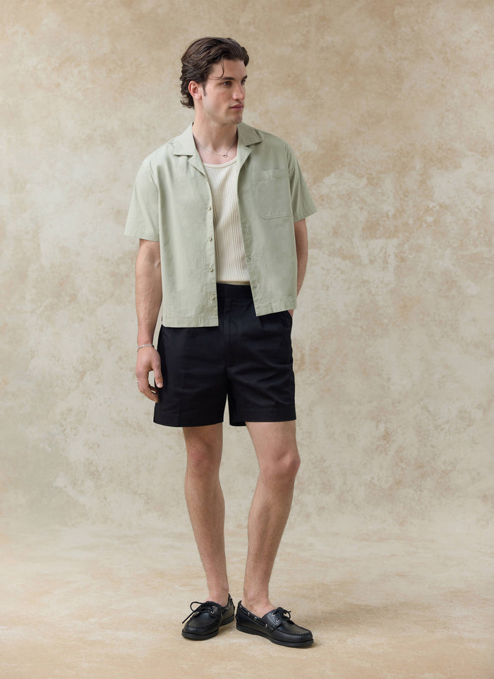 Percival Daniel Boxy Cuban Shirt in pistachio cotton, styled with shorts; want more? Check out the SS26 collection.