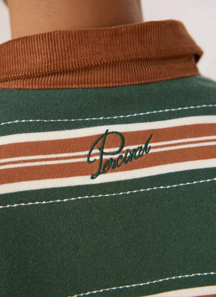 Close-up of the Guinness x Percival rugby polo in green stripe, highlighting the brown cord collar and back embroidery.