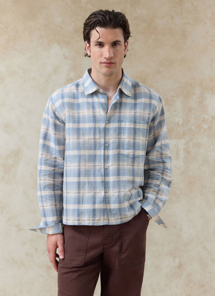 Percival Jesse Cropped Shirt in light blue check linen-cotton, featuring a boxy fit and chest pocket, worn by a model.