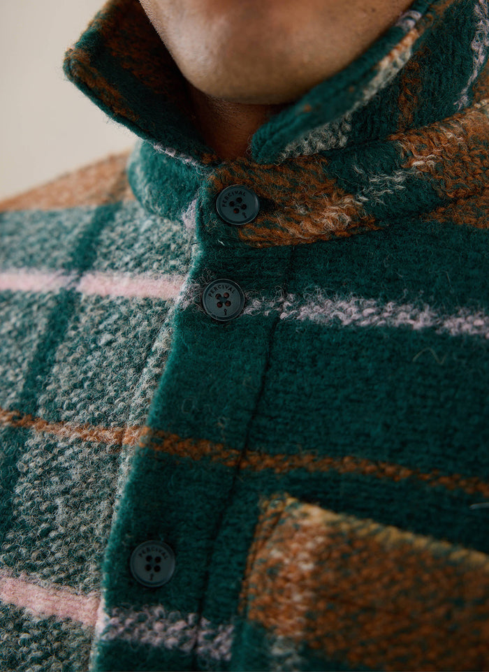A close-up shot of the multi-check wool Percival Knowles Overshirt, highlighting the button placket and collar.