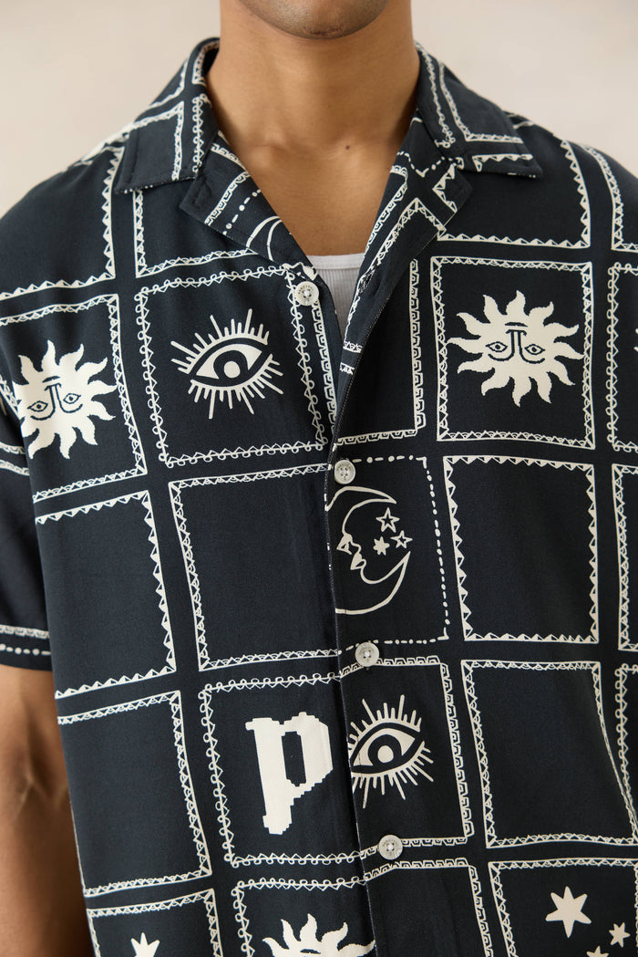 The Percival Lunar Panel Cuban Shirt in black viscose, featuring white celestial graphics and a classic button front.