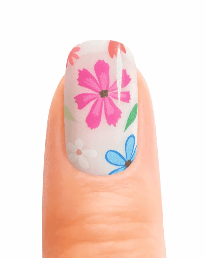 Stickers ongles en gel fleuris multicolores sur fond transparent rosé