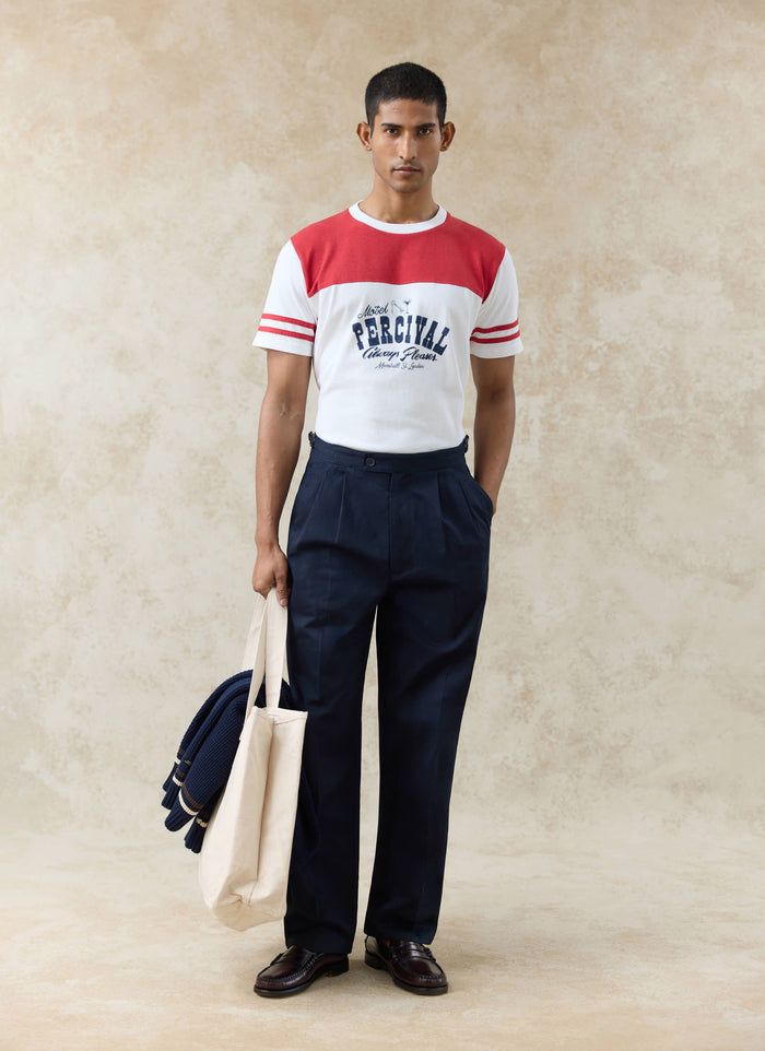 White and red organic cotton Motel Percival T-shirt with a vintage chest graphic and red yoke, worn by a model.