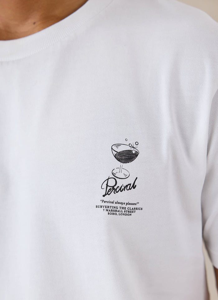 Close-up of the white Percival organic cotton T-shirt featuring a small cocktail chest graphic and branding.