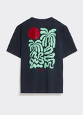 The navy Percival Palms T-Shirt, featuring a large seafoam palm and red sun back graphic, made from soft cotton jersey.
