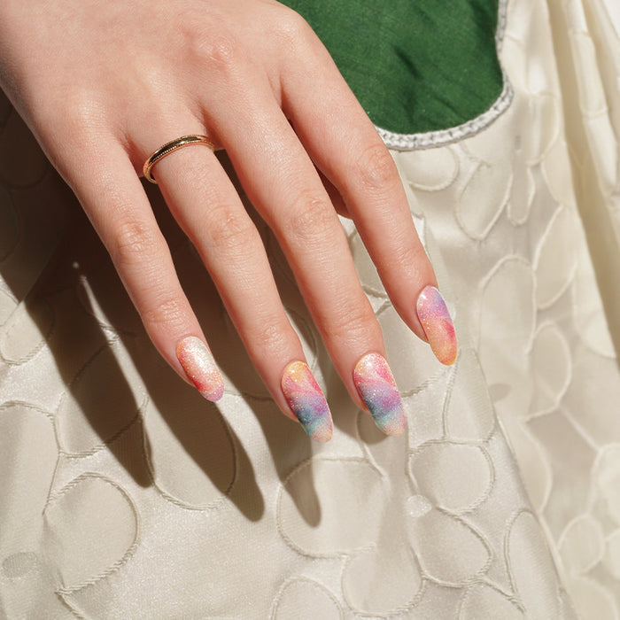Stickers ongles gel effet sable pailleté multicolore aux teintes pastel fondues façon tornade artistique