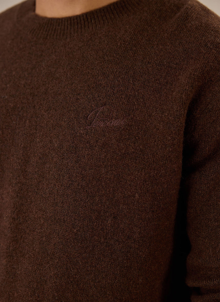 Close-up of the espresso brown Percival mohair boxy crew neck jumper highlighting the chest embroidery.